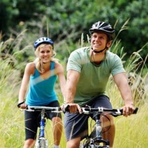 active couple biking outside
