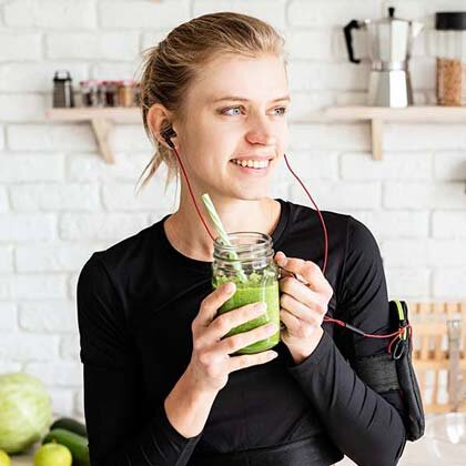 women drinking moringa supplements