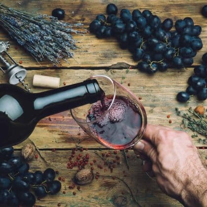 Wine Maker Pouring Red Wine